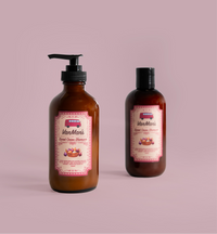 Two bottles of VanMan's Sweet Onion Shampoo sit against a soft pink background.
