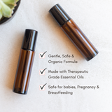 Showcases two amber glass roller bottles of gentle, organic essential oils, highlighting their safe use during pregnancy and breastfeeding.

