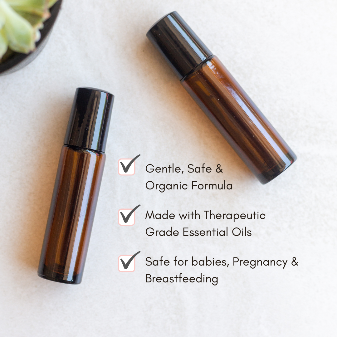 Showcases two amber glass roller bottles of gentle, organic essential oils, highlighting their safe use during pregnancy and breastfeeding.

