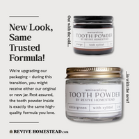 Revive Homestead advertises their remineralizing tooth powder, now available in new wintergreen packaging alongside the classic orange flavor, both containing xylitol.
