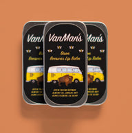 Three tins of VanMan's Bison Beeswax Lip Balm show a bison and a vintage VW bus.
