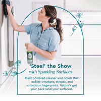 Woman cleans a stainless steel refrigerator with a plant-based Puracy stainless steel cleaner and microfiber cloth.
