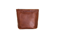 Displays a stylish, light brown leather bucket bag with detailed stitching and a soft, supple texture.
