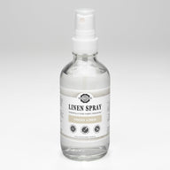 Rustic Strength sells its Fresh Linen Spray in a clear bottle.