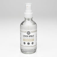 Rustic Strength sells its Fresh Linen Spray in a clear bottle.
