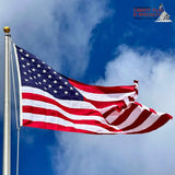 American flag waving against a blue sky with a visible brand logo.