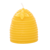 A yellow beeswax candle, shaped like a beehive and adorned with a small bee, stands ready to provide natural light.
