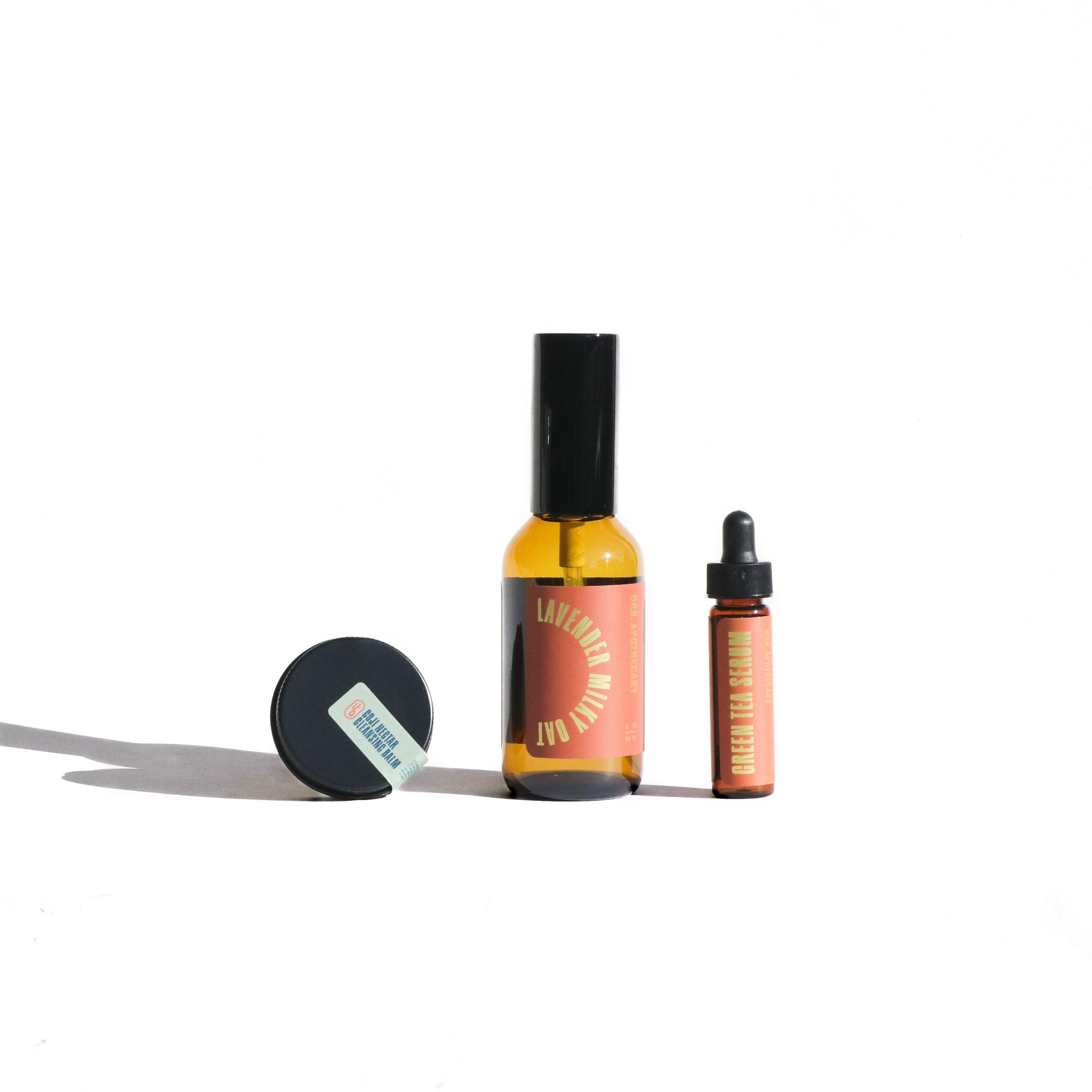 Showcases a curated collection of Urban Apothecary skincare products, including cleansing balm, lavender milky oat spray, and green tea serum.
