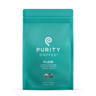 Purity Coffee's teal bag showcases their "Flow" medium roast ground coffee, emphasizing organic and bird-friendly sourcing.
