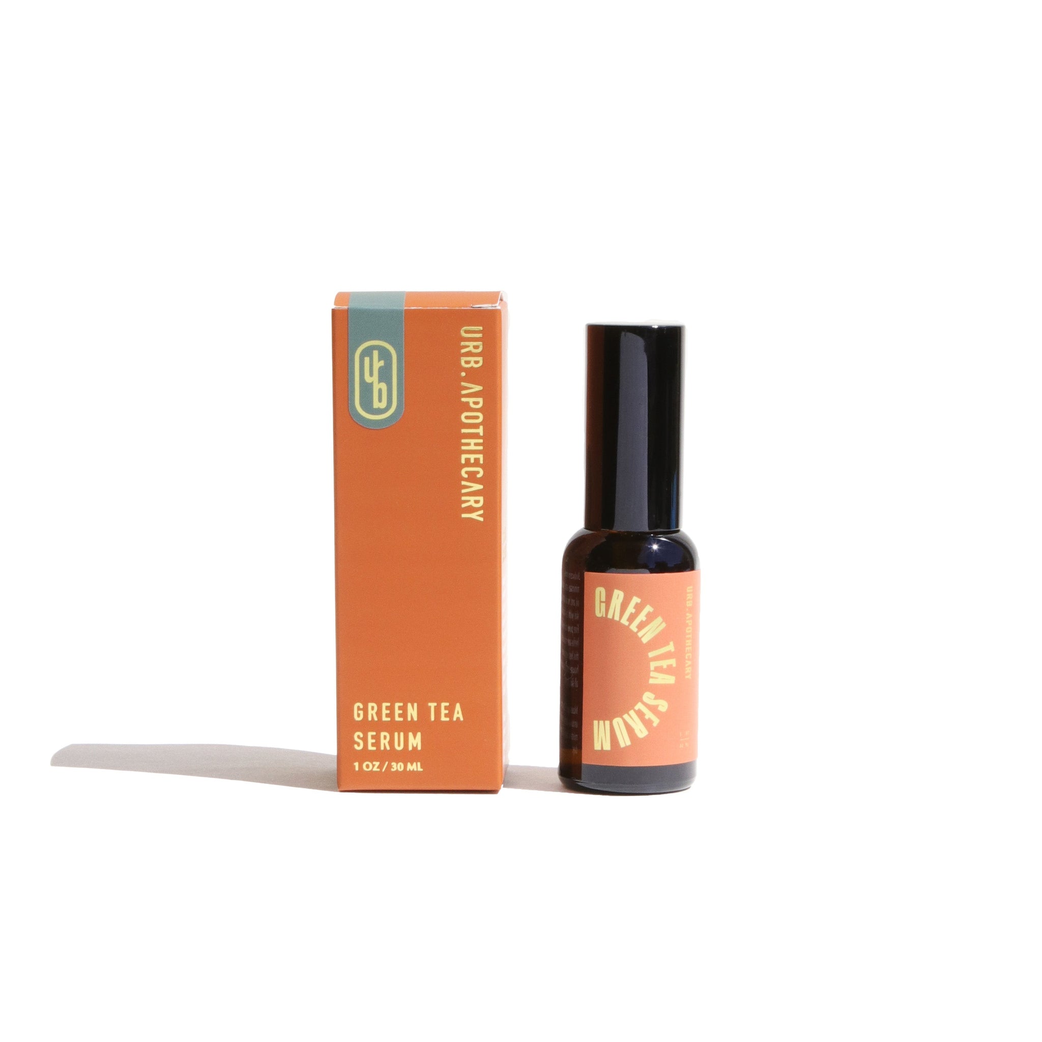 URB. Apothecary presents their Green Tea Serum in orange packaging alongside the dark bottle.
