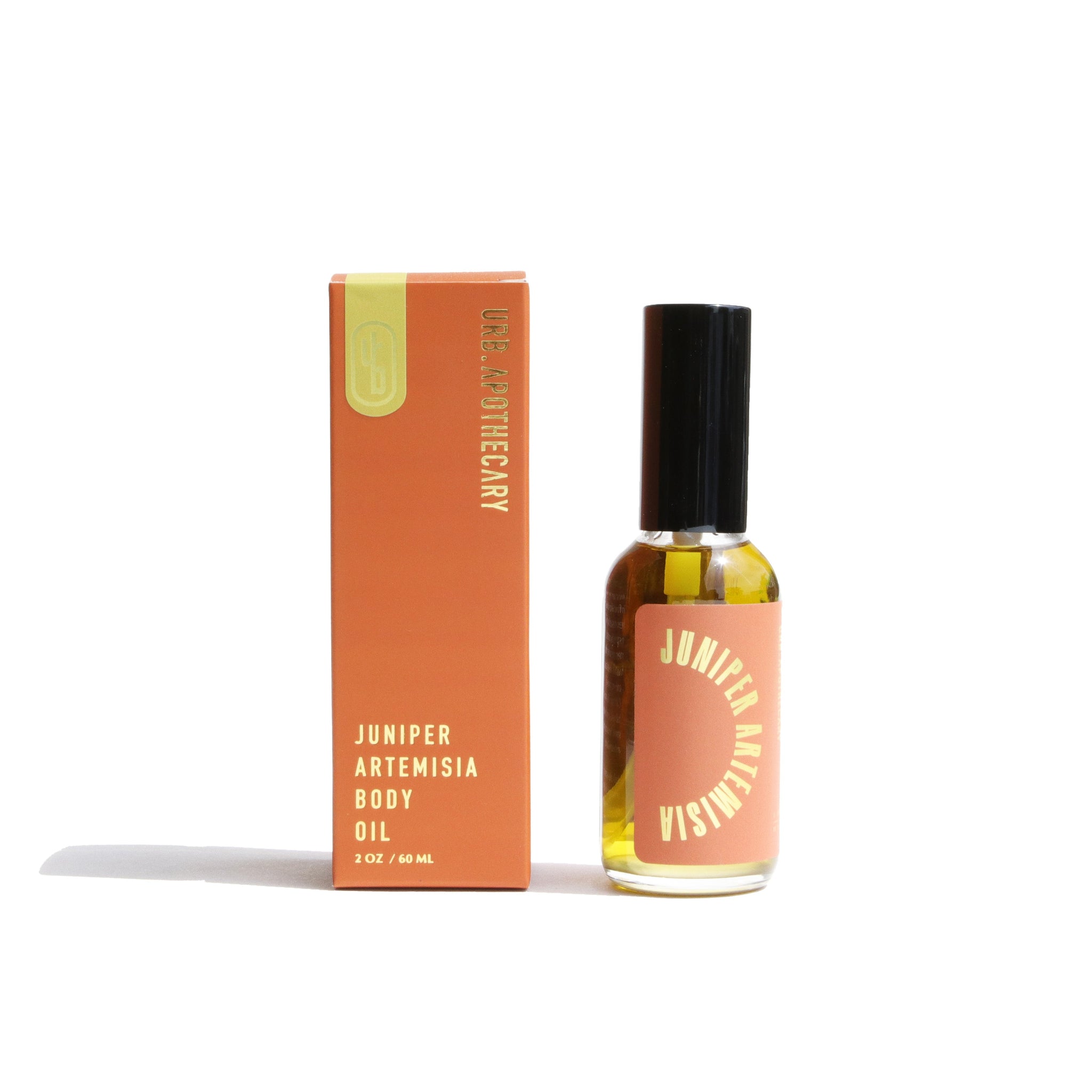 URB Apothecary's Juniper Artemisia body oil displays alongside its orange box on a white background.
