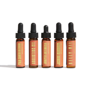 Urb. Apothecary displays five amber dropper bottles featuring essential oils like Palo Santo Vetiver and Jasmine Mandarin.
