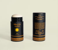 Two tubes of tallow and zinc sunblock display organic ingredients and SPF 20 sun protection.
