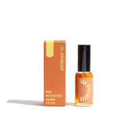Showcases the Urb Apothecary Sun Worshiper Serum next to its box, highlighting the natural skincare product.
