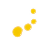 Golden beauty oil droplets gleam against a clean white background.
