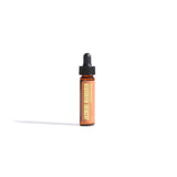 Jasmine Mandarin aromatherapy oil in a small bottle with a dropper cap sits on a white surface.
