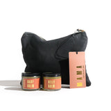 Shows Urb Apothecary Mama and Baby balm gift set with black pouch.
