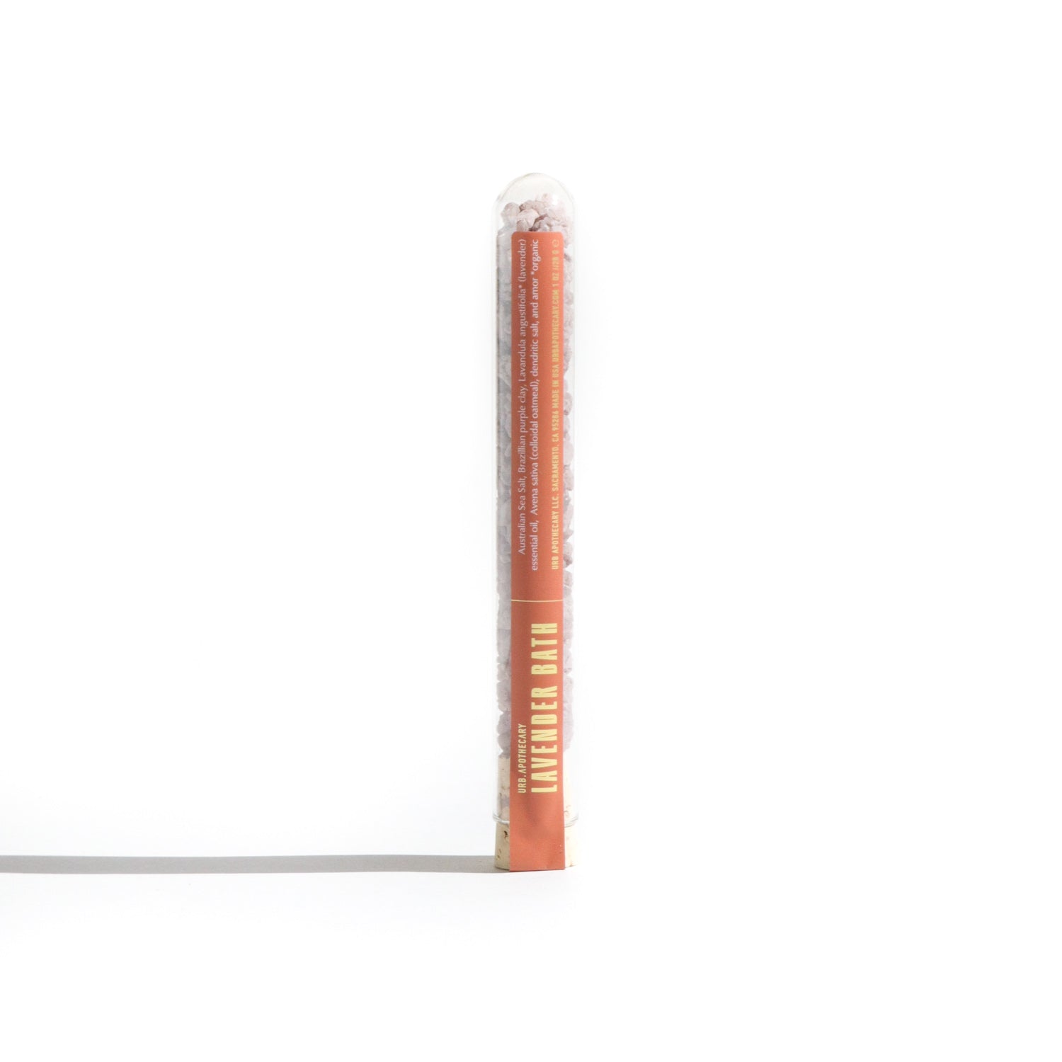 Urb. Apothecary presents lavender bath salts in a clear tube, advertising a relaxing spa experience.
