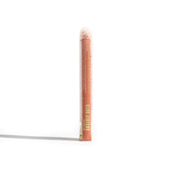 Showcase Urb. Apothecary Rosehip Bath salts in a clear tube, highlighting its blend of Himalayan pink salt and essential oils.
